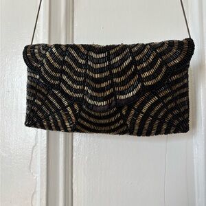 Elegant Black and Gold Clutch Bag